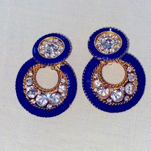 Striking Vintage rhinestone and deep blue enamel clip on earrings.